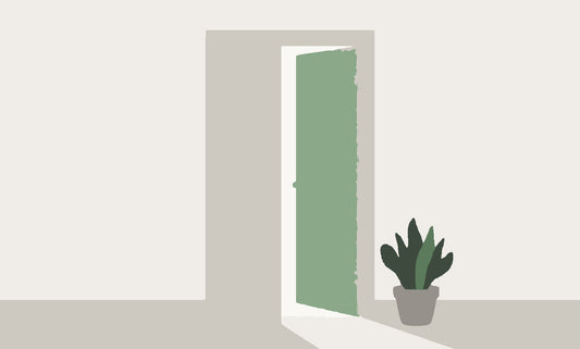 A flat illustration of a door standing slightly ajar with soft light spilling through the gap onto the floor.